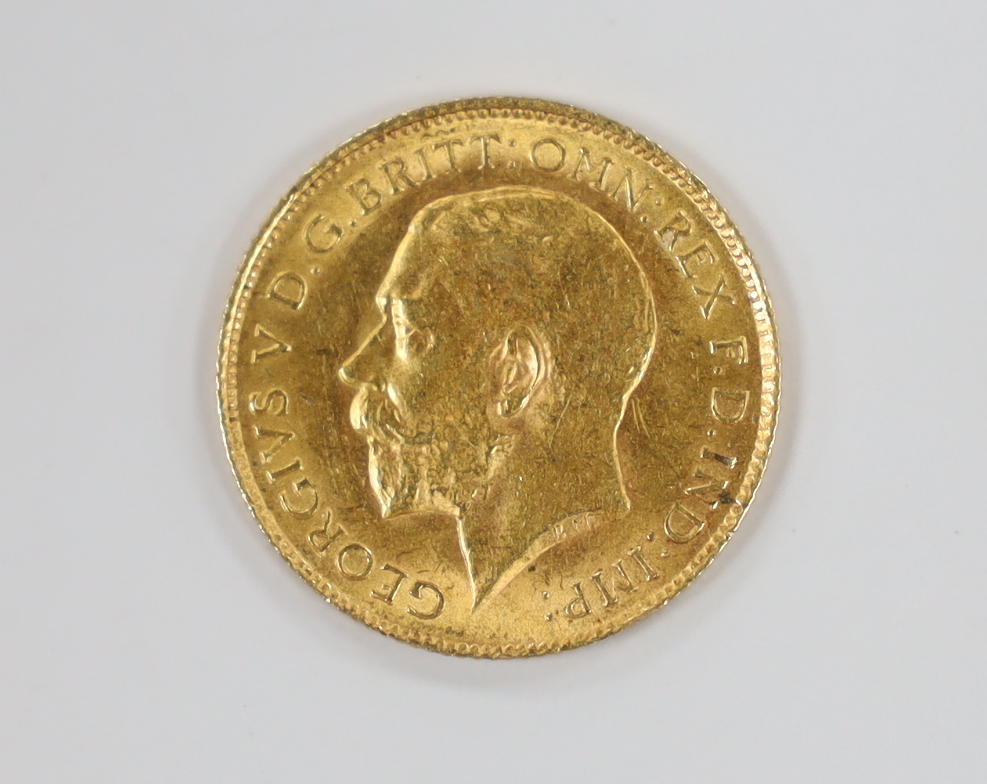 A George V 1914 gold half sovereign.